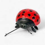 Cast iron ladybug garden ornament with shiny finish and poseable antennae