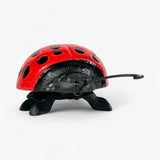 Cast iron ladybug insect decor with articulated legs in three-quarter angle