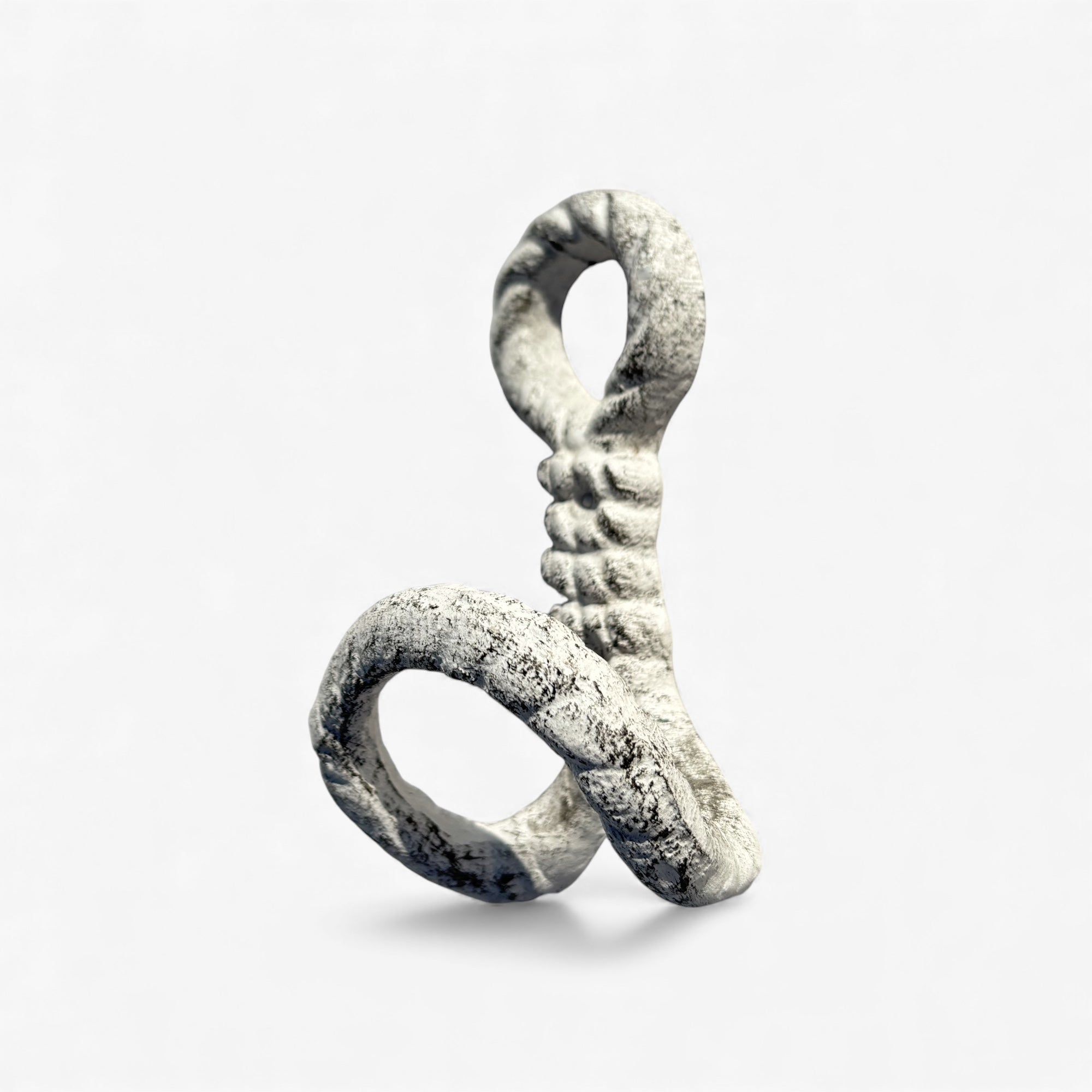 Close-up of white textured cast iron rope hook with decorative twist detail