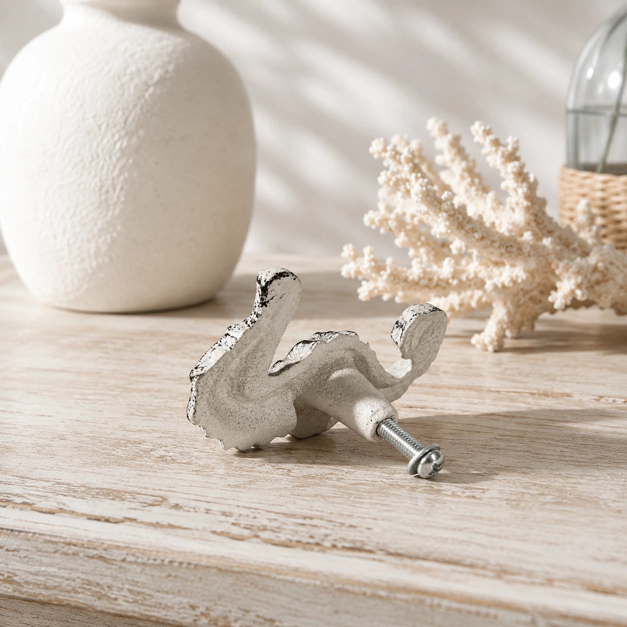 Back view of distressed white seahorse cabinet knob with mounting screw