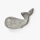 Whale-shaped cast iron cabinet pull with white distressed patina, side profile view