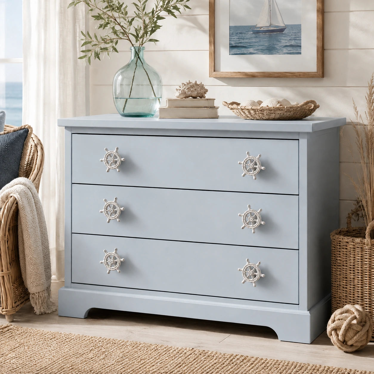 Coastal blue dresser with distressed white ship wheel knobs and seaside decor