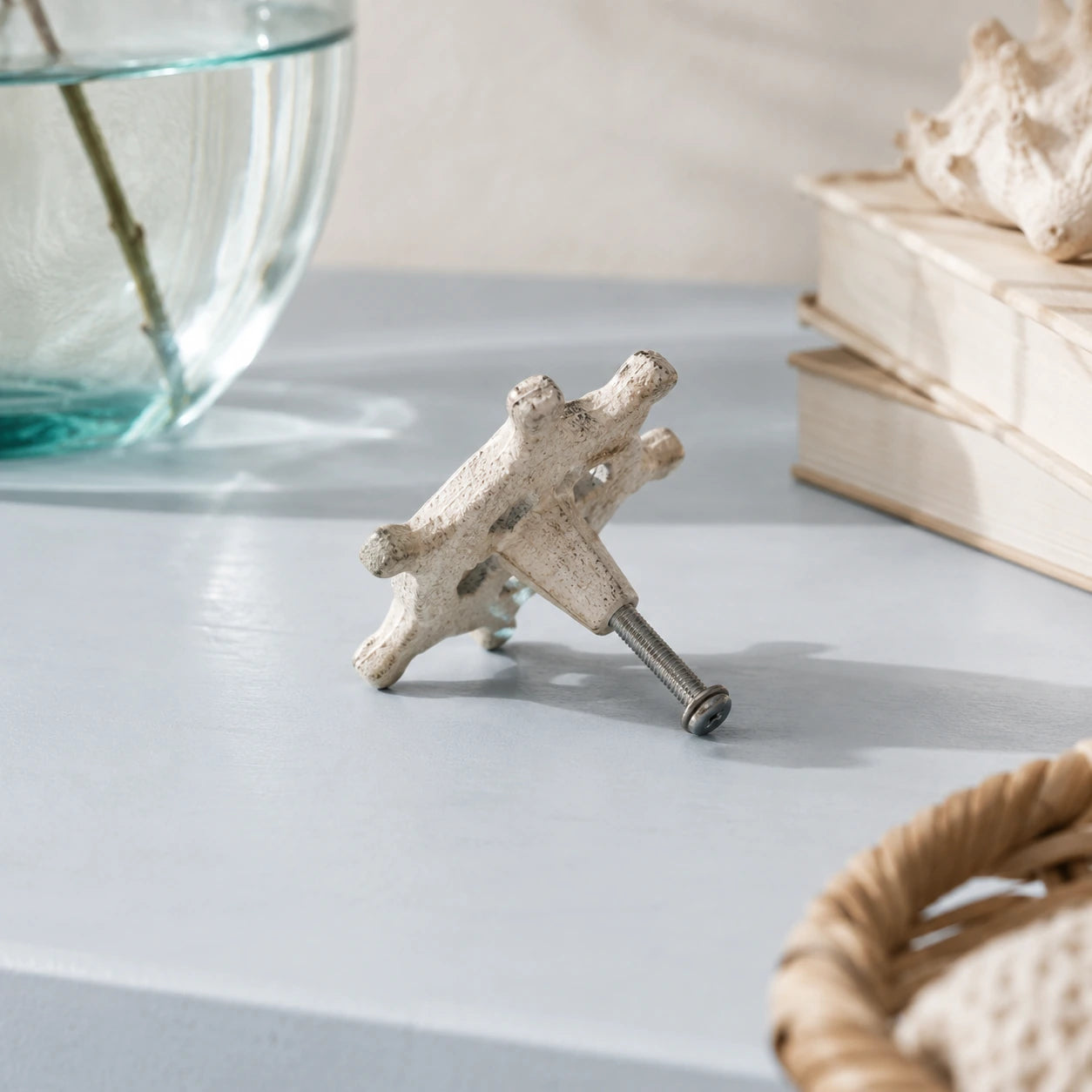 Back view of distressed white ship wheel cabinet knob with mounting screw