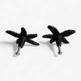 Brass starfish knob pair with metal screws, aged patina finish, back view