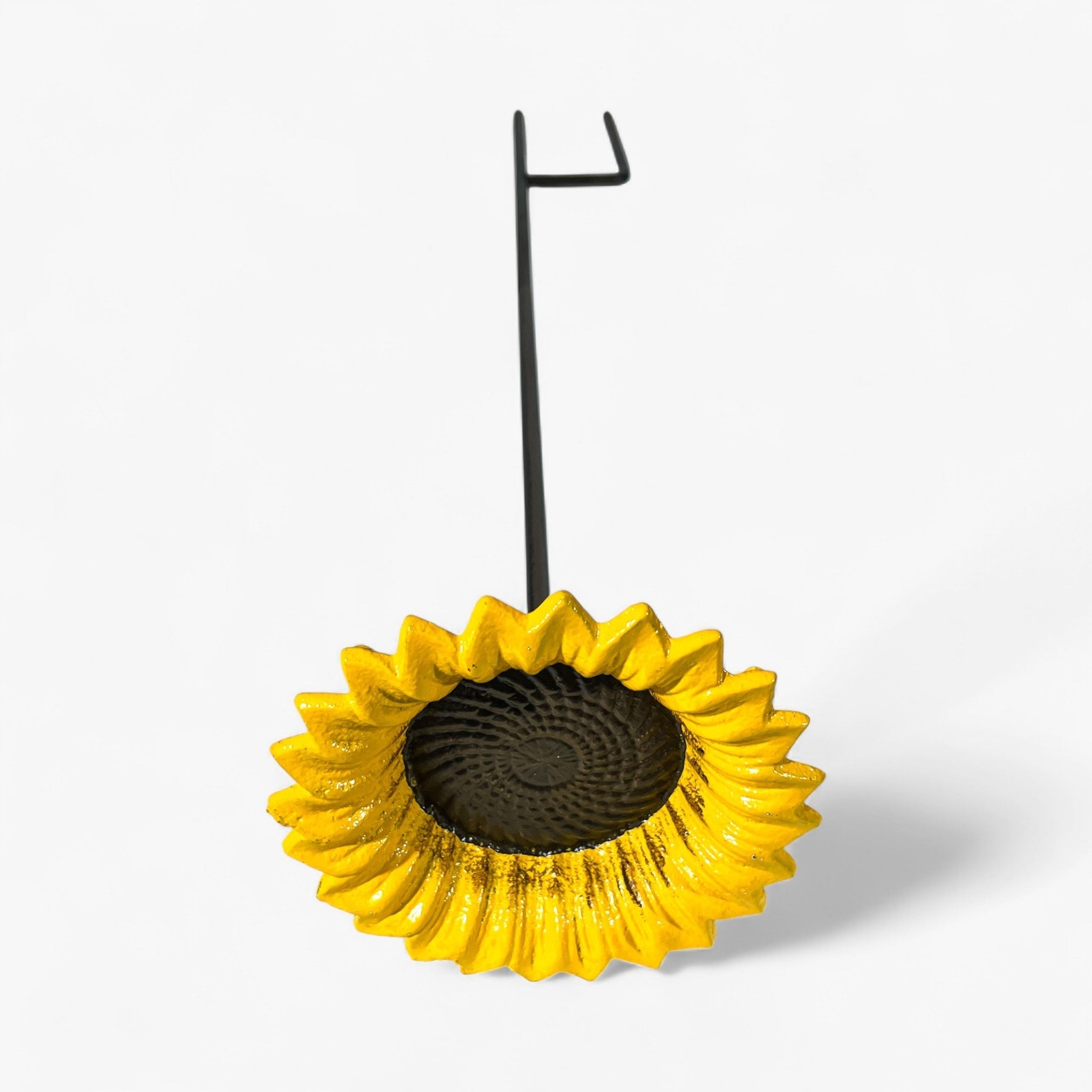 Yellow sunflower cast iron bird feeder with textured black center and curved stake