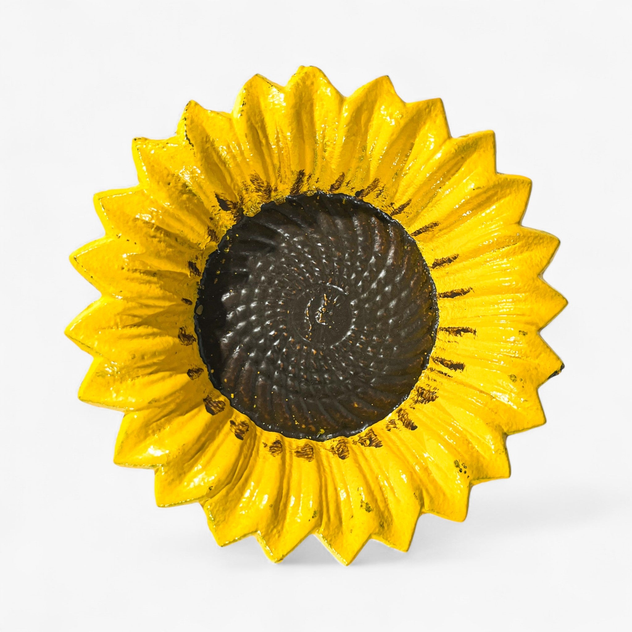 Cast iron bird feeder, sunflower design, interior spiral pattern visible, stake attachment