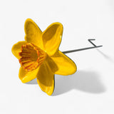 Side view yellow daffodil cast iron stake with ground stake visible and dimensional flower details