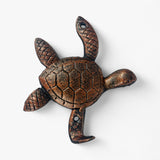 Bronze cast iron sea turtle hook with detailed shell pattern and curved mounting arm