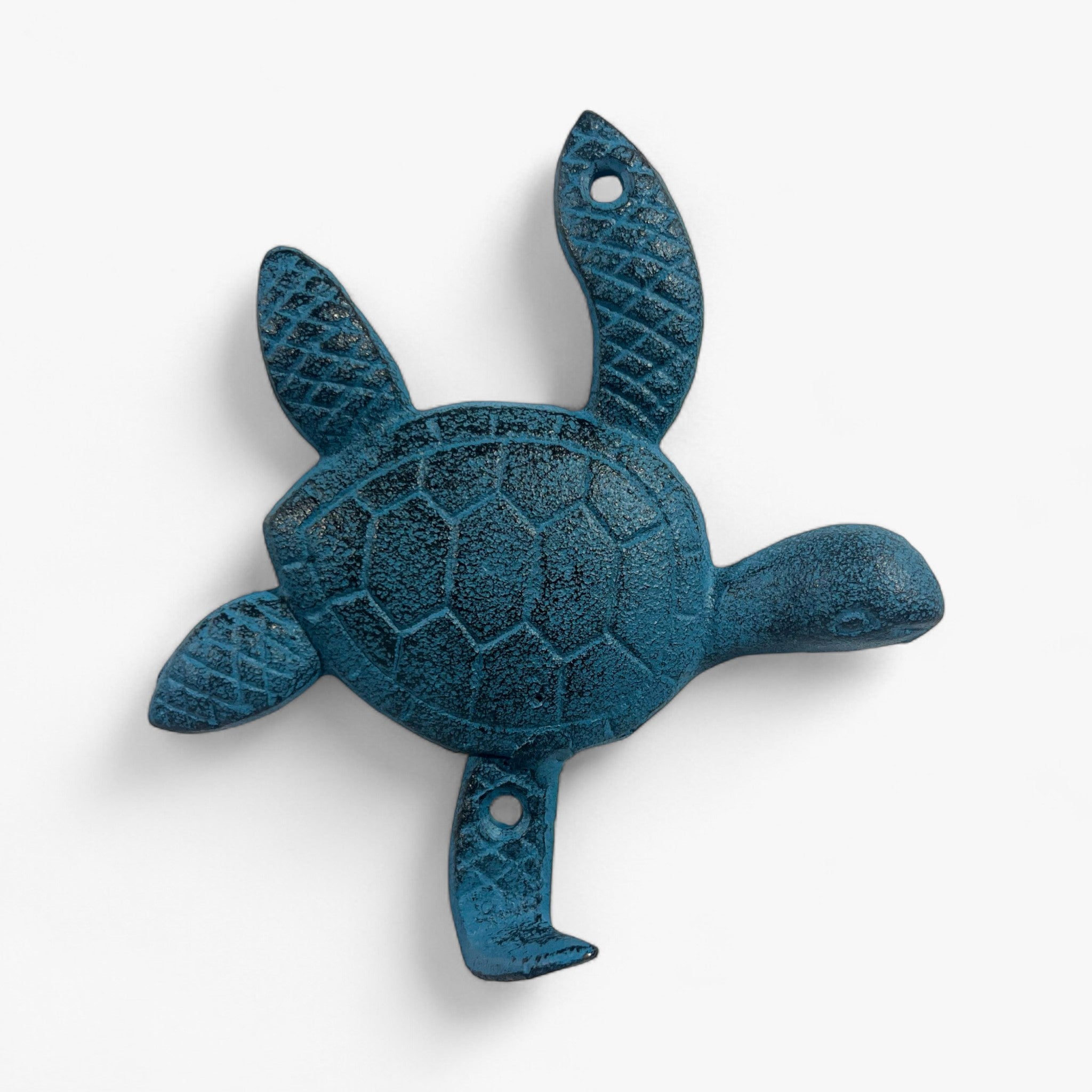 Three cast iron turtle hooks displayed: bronze, gold, and teal with shell detailing