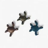 Turquoise patina cast iron sea turtle hook with textured shell and four-pronged design