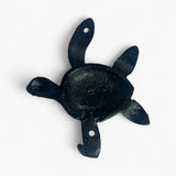 Dark teal cast iron sea turtle hook with aged verdigris finish and textured arms