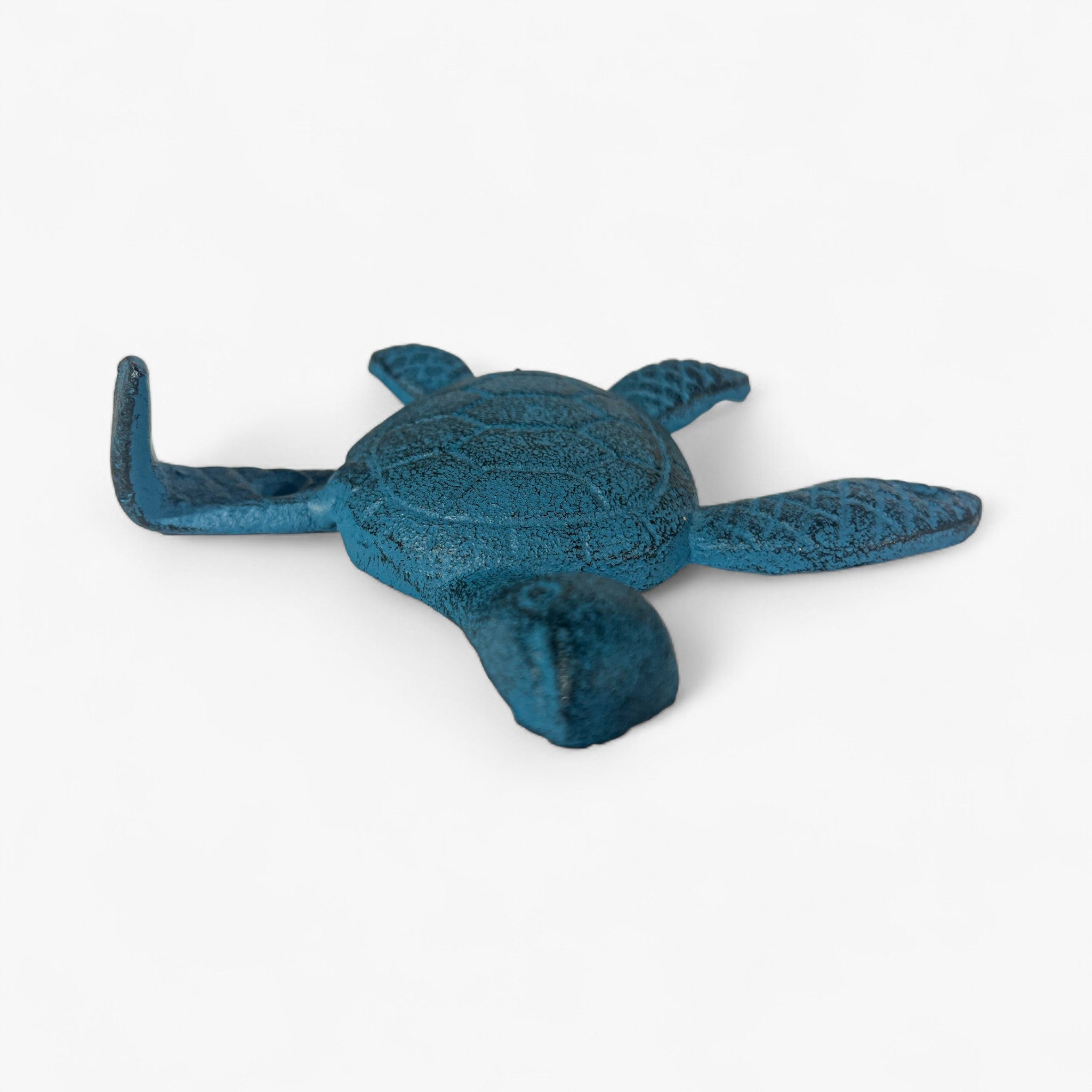 Teal cast iron sea turtle hook showing side profile with shell texturing and mounting prong