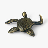 Antique brass cast iron sea turtle hook with distressed patina and dimensional shell relief