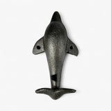 Textured gray cast iron dolphin tail hook with head detail, top view