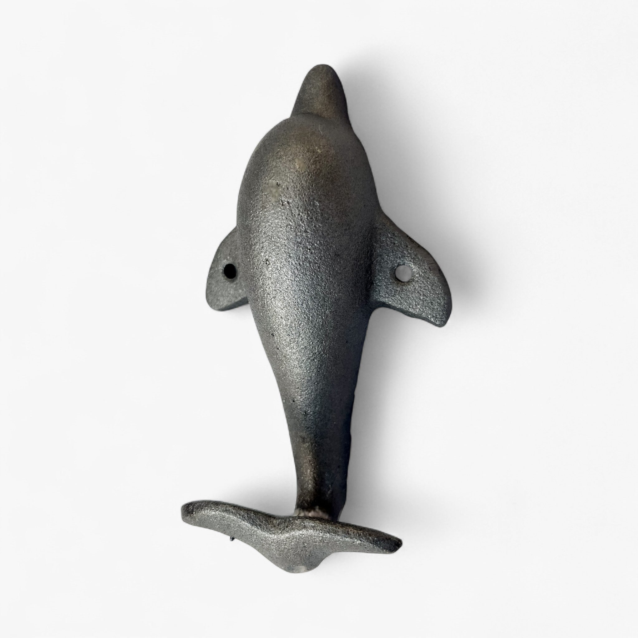 Gray cast iron dolphin tail coastal wall hook with curved tail fin