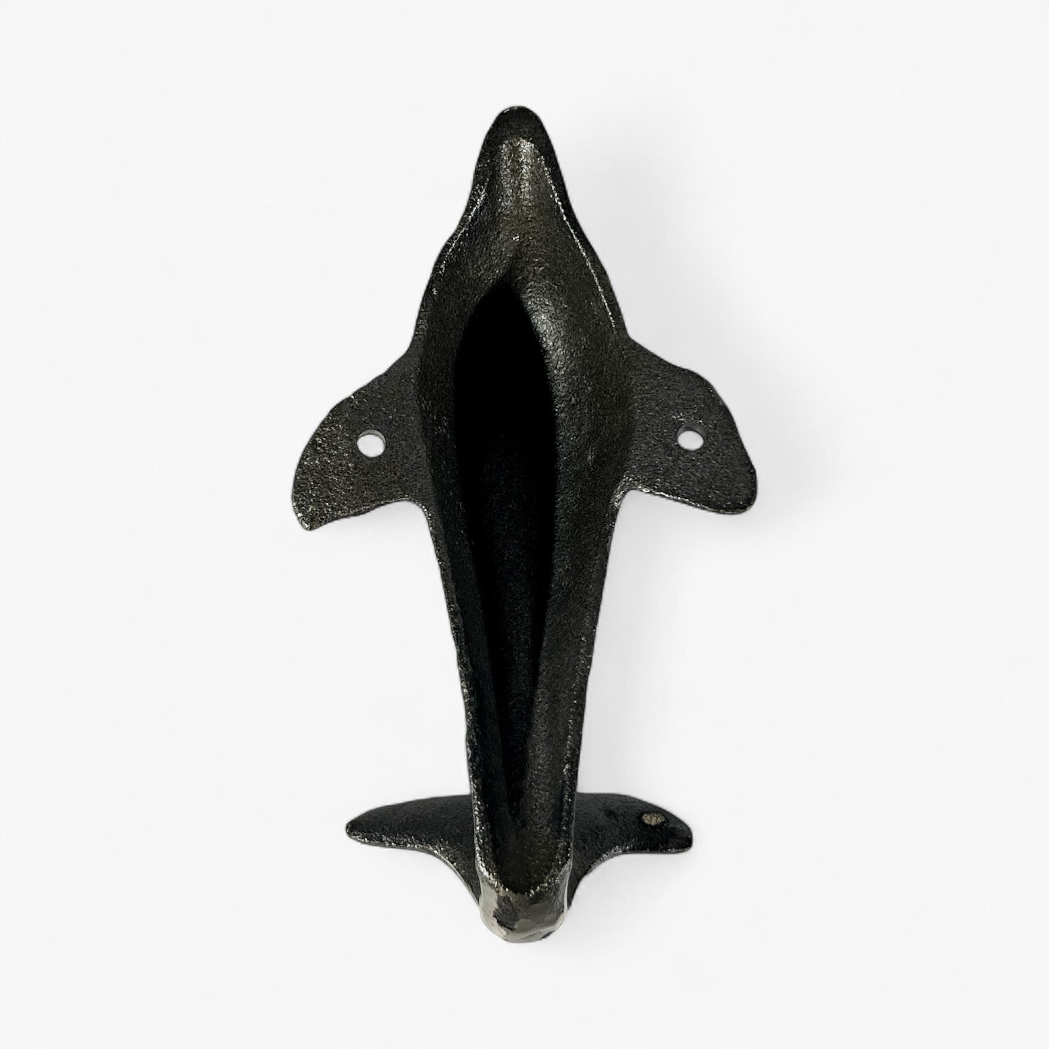 Dark cast iron dolphin tail hook, back view showing hollow body and mounting holes