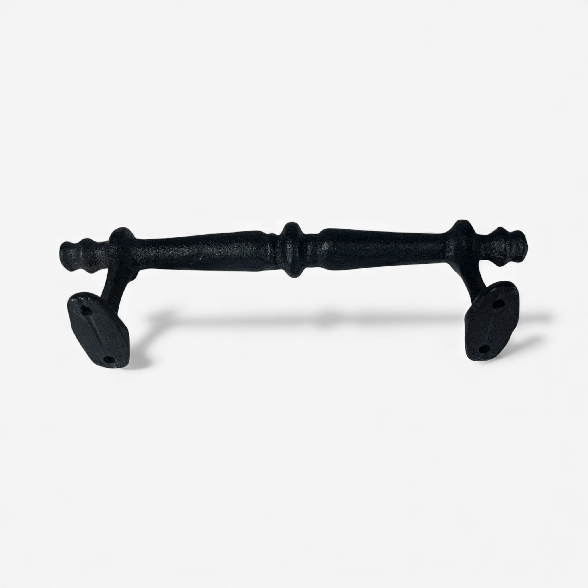 Black cast iron door handle with ornamental pulls and decorative center knob