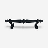 Rustic black cast iron pull hardware with textured finish and vintage knob details