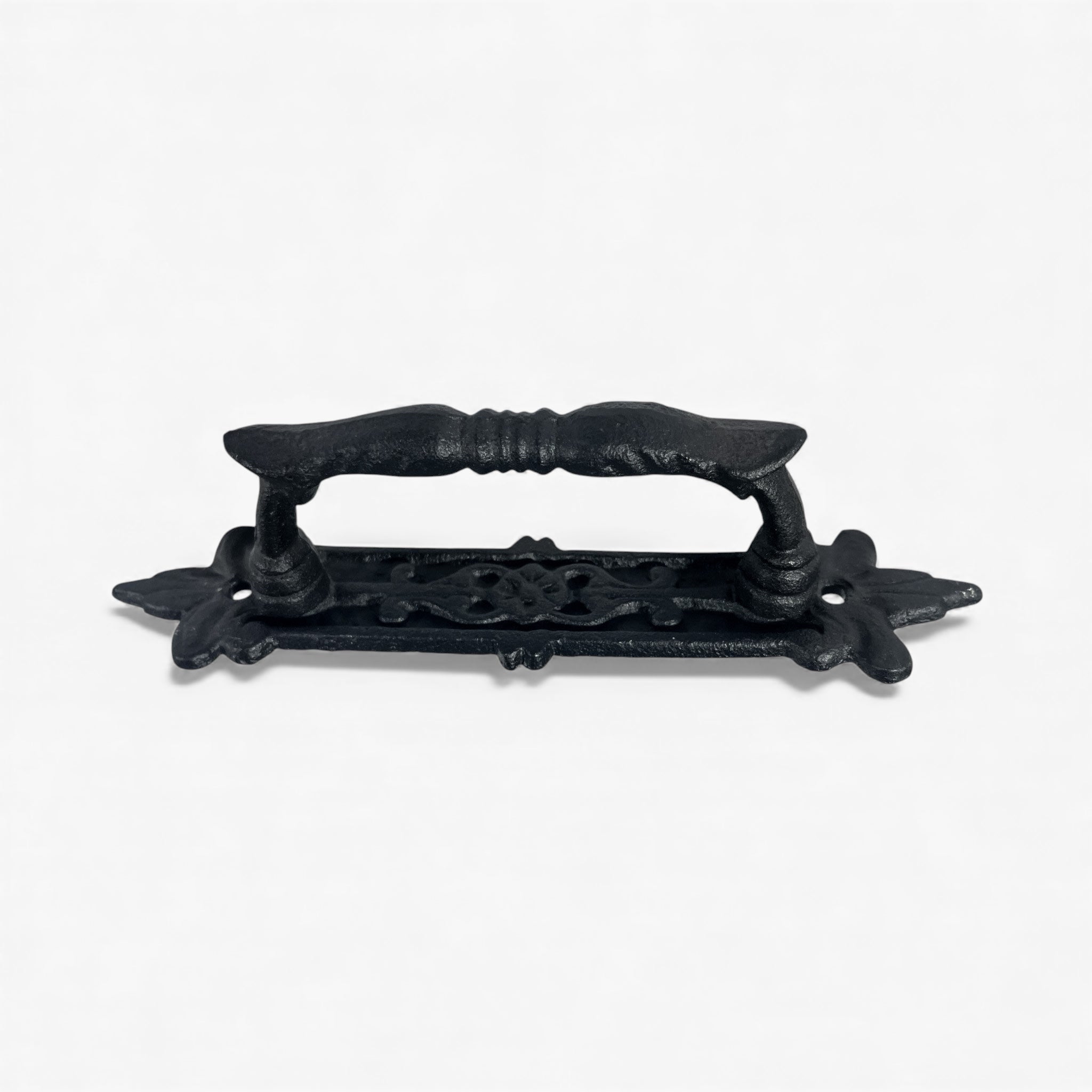 Ornate black cast iron door handle with floral base plate and vintage grip design