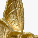 Gold bee shaped home decor dish from side profile highlighting dimensional sculptural form