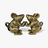 Two gold cast iron mice figures facing each other, decorative pair