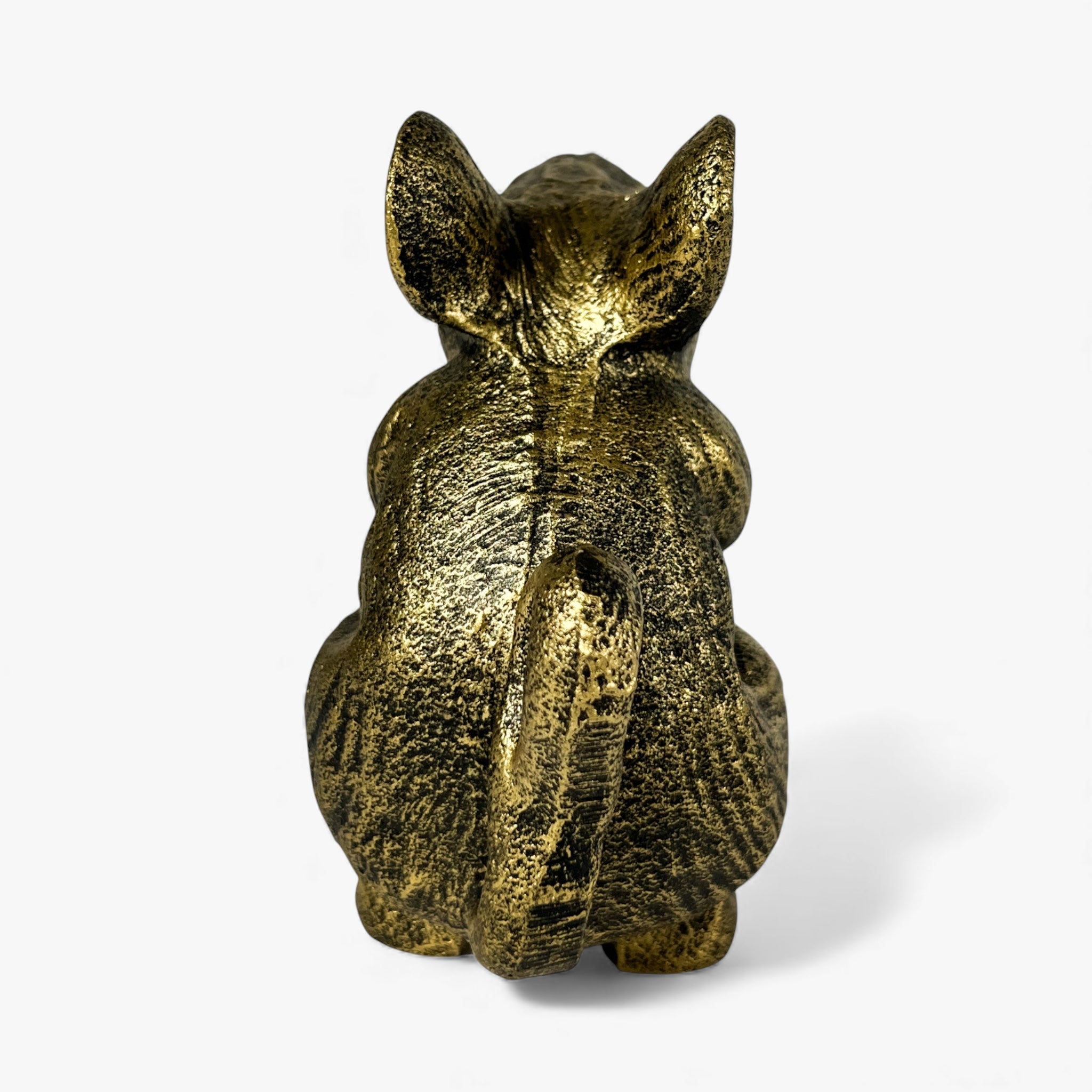 Rear view of gold cast iron mouse door stop, distressed finish detail