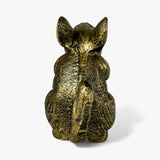 Rear view of gold cast iron mouse door stop, distressed finish detail