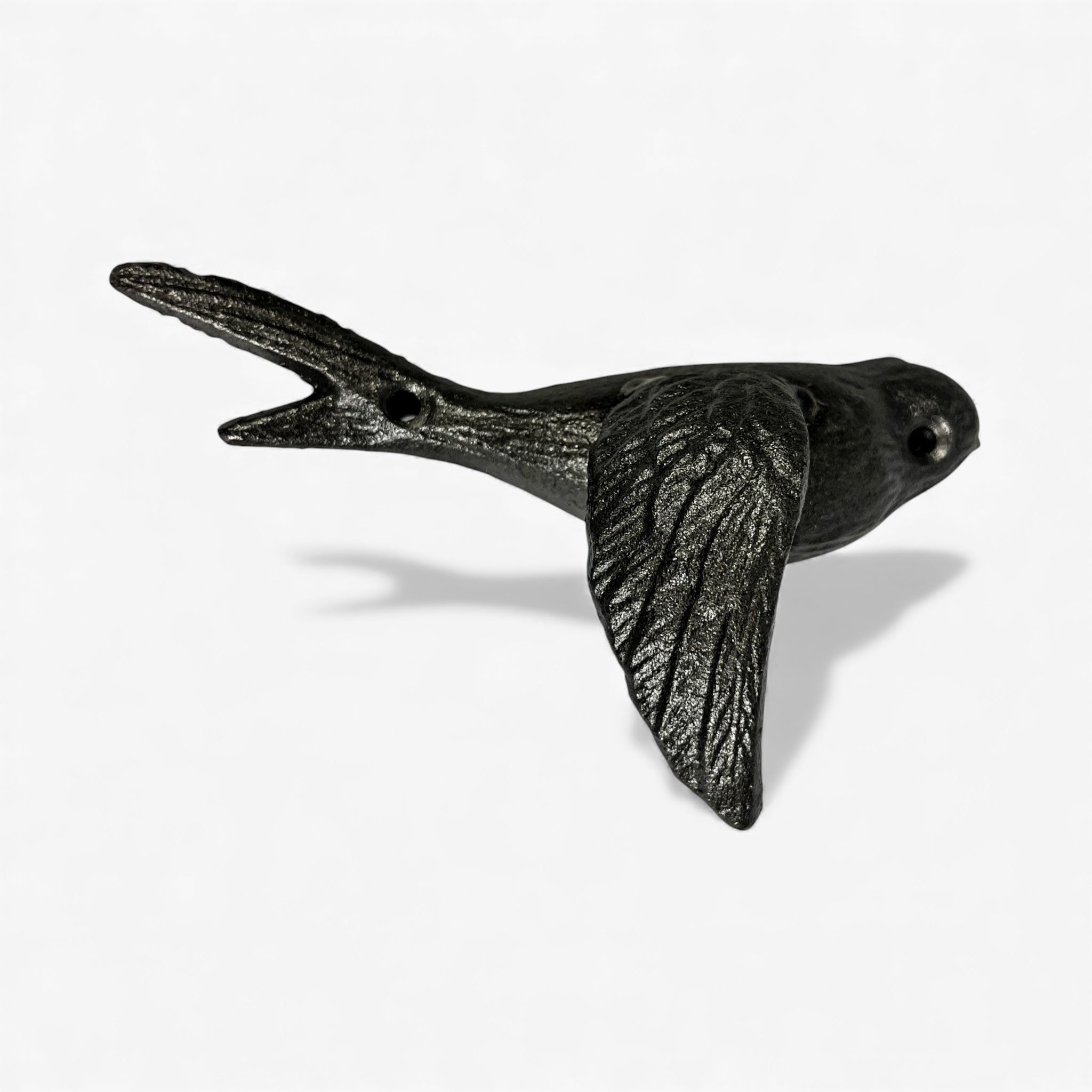 Rustic cast iron bird hook with wings raised upward showcasing fine feather etching detail