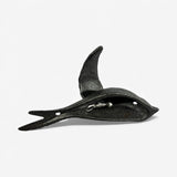 Cast iron bird wall hook with upright wing detail and weathered natural iron texture