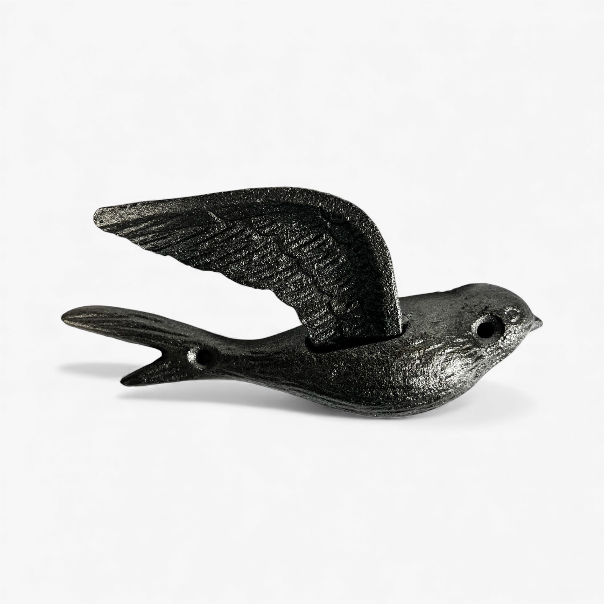 Black iron bird wall hook in flight pose with outstretched wings and carved feather patterns