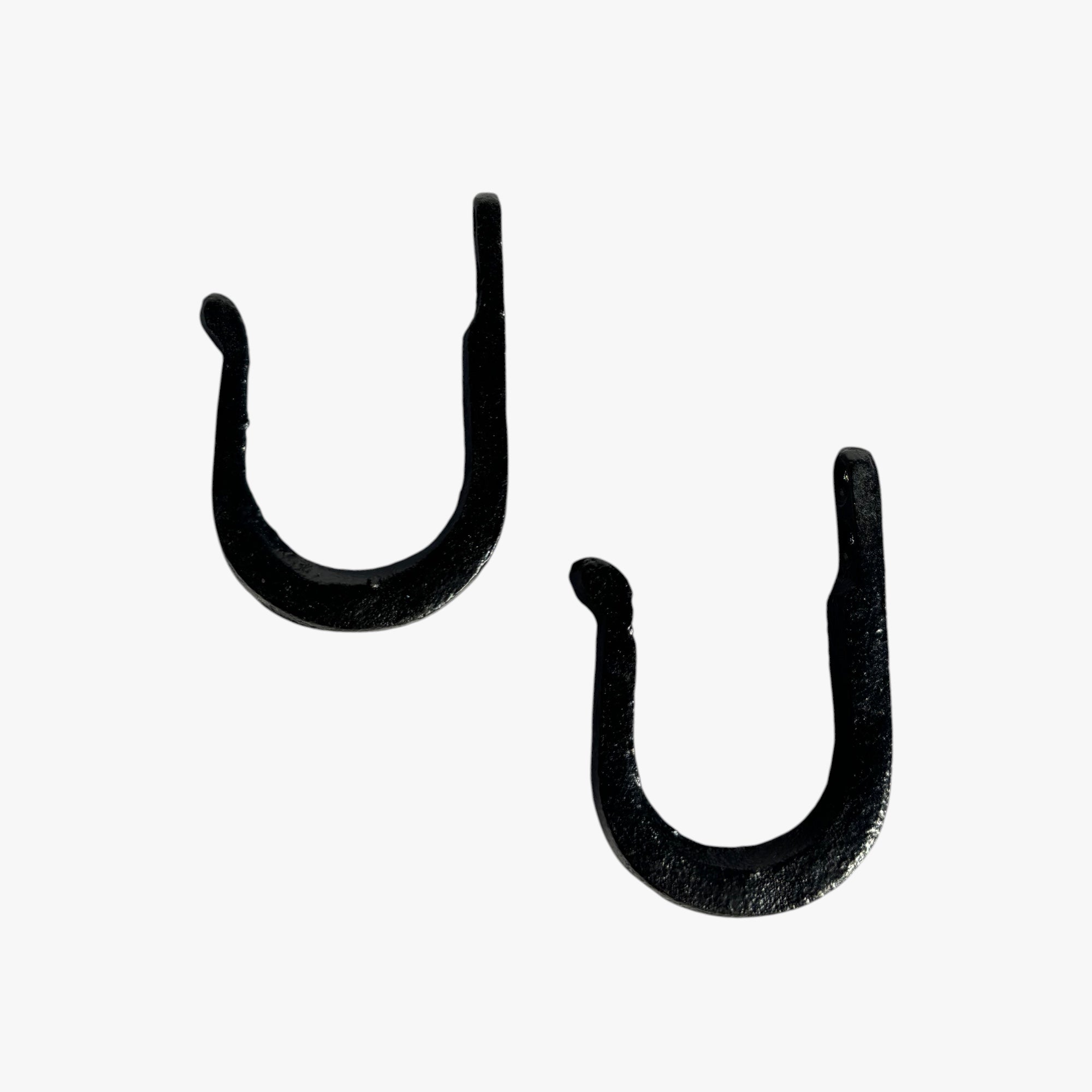Three black cast iron wall mounted hooks, various sizes heavy duty hangers