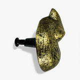 Gold fox cabinet pull with black metal screw mounted on white background