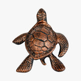 Distressed black cast iron sea turtle key hider with scale details and hollow shell storage