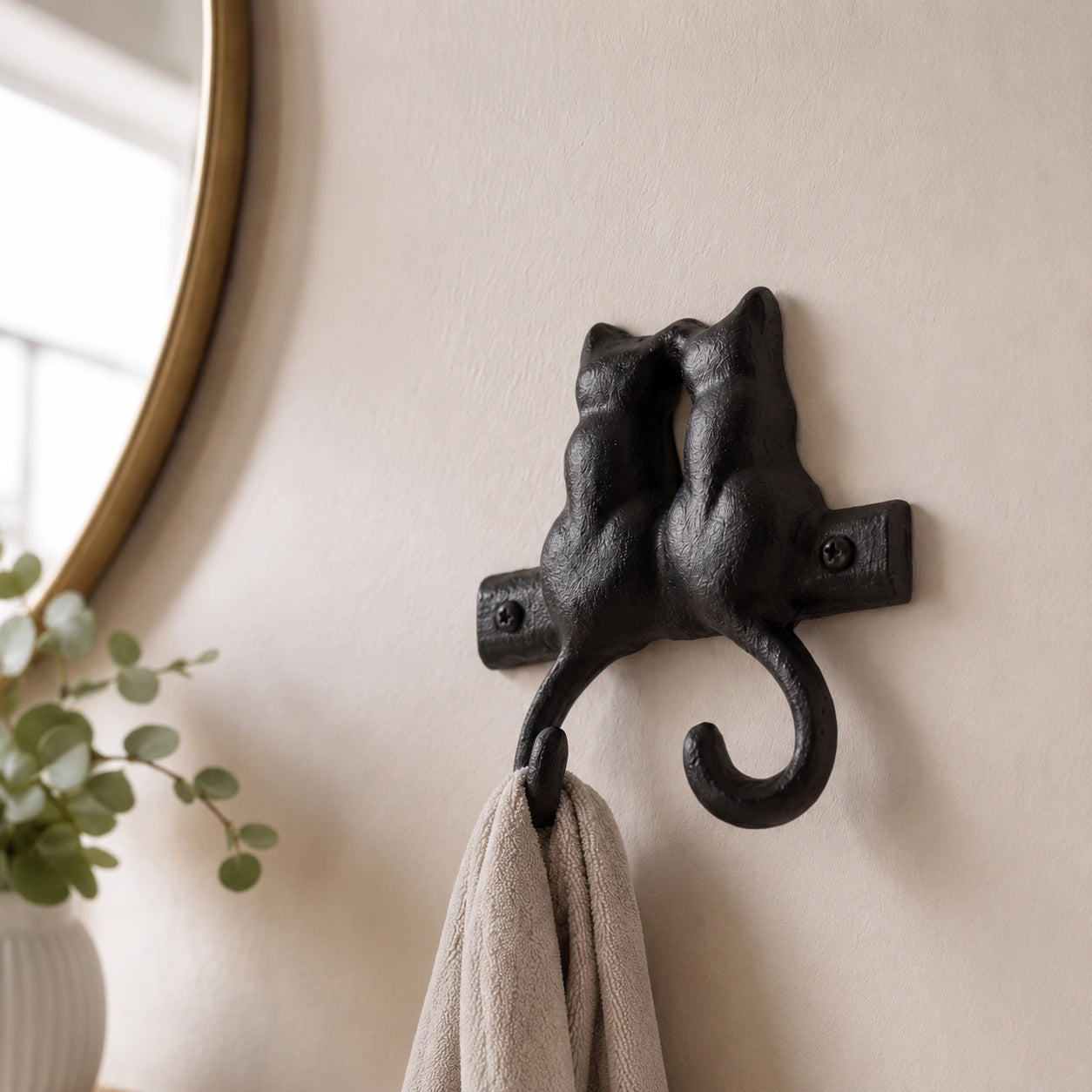Close view of two black cast iron cat silhouettes above double hooks, SKU GB78064