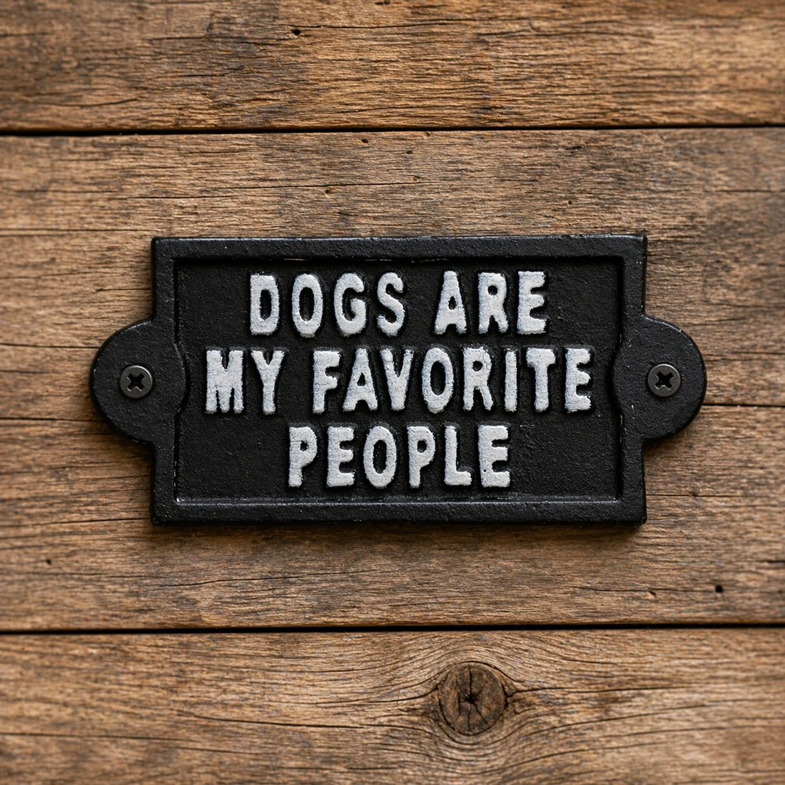 Black cast iron wall sign with white Dogs Are My Favorite People lettering.