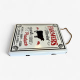Top view of vintage metal farmers market sign showing rope handles and white finish