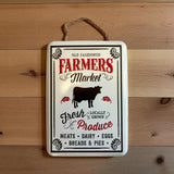 Vintage farmers market cow metal wall sign with rope hanger, red and black text on cream