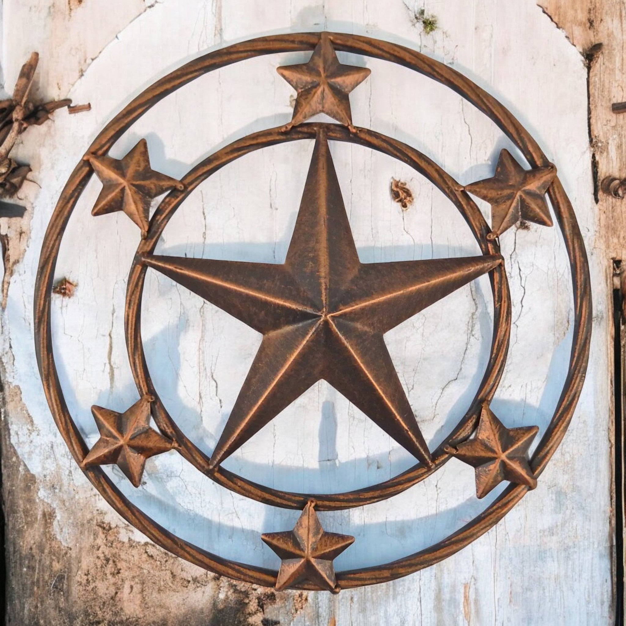 Rustic brown cast iron 12-inch star wall decor with surrounding stars